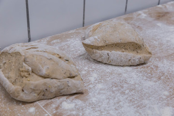 Raw bread loafs ready to enter them in the oven