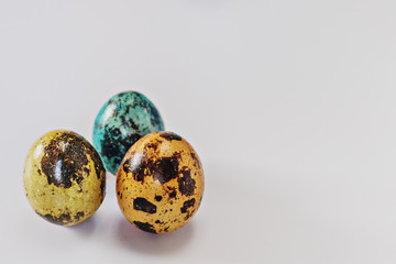 Painted multi-colored quail easter eggs. Easter during the coronavirus pandemic.