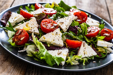 Fresh greek salad - feta cheese, tomato, lettuce, black olives and onion