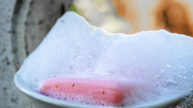 Pink Soap With Bubbles On Wooden, Washing Hand Away From Virus. Healt Concept