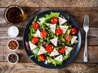 Fresh greek salad - feta cheese, tomato, lettuce, black olives and onion