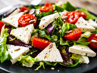 Fresh greek salad - feta cheese, tomato, lettuce, black olives and onion