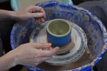 Fototapeta na wymiar Pottery hobby. Handcrafted earthenware. Ceramic craft master