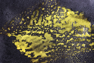 Golden water drops isolated on a black background