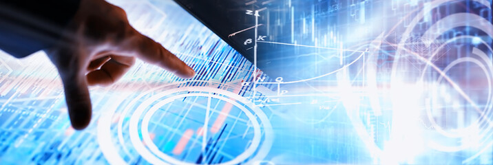 Business concept. Information technology and data processing. Hands over the screen with graphic data. A modern software product in business.