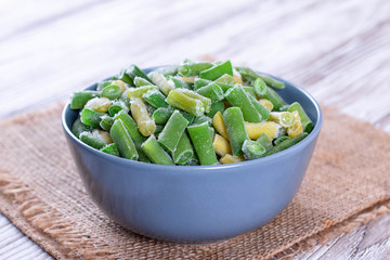 Frozen green beans in bowl