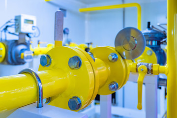 Gas industry. Yellow pipes in the enterprise. Natural gas supply. Gas distribution station equipment. Pipes on the background of the flowmeter. Accounting of natural resources.
