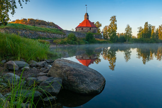 Karelia. Russia. The fortress of Korela on the background of the lake. Fortress in the city of Priozersk. Sights Of Karelia. The old protective structure. Stone fortress on the shore of the lake.