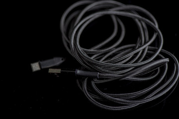 USB Type-C cable. Photographed close-up against a dark background.