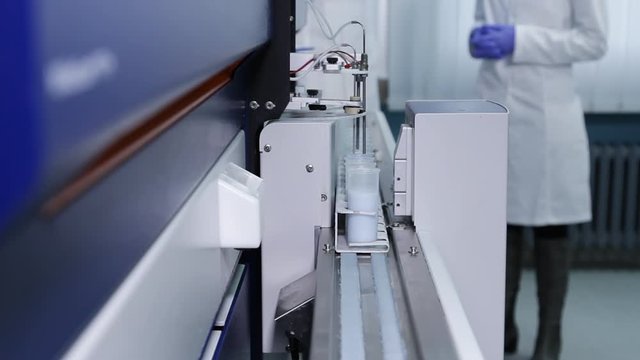 Laboratory automated apparatus testing milk for aflatoxins