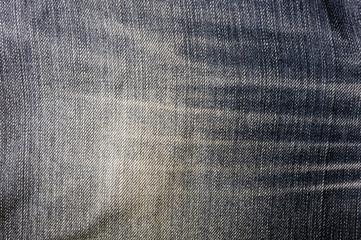 clothing items blue stonewashed faded jeans cotton fabric texture with seams, clasps, buttons and...