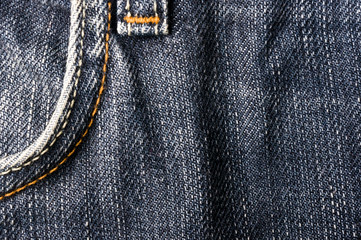 clothing items blue stonewashed faded jeans cotton fabric texture with seams, clasps, buttons and rivets, macro, close-up