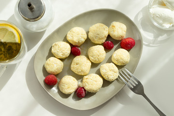 Homemade baked cheese pancake with sour cream and berries. Breakfast time. Top view.