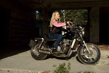 Fototapeta na wymiar biker girl want ride motorbike