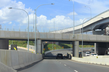 New road ramps, concrete pylons and concrete barriers at the M4's Concord Interchange. The view is...