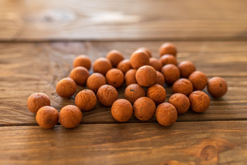 Carp baits on a wooden background.