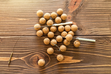 Carp baits on a wooden background.