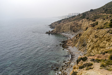 Fototapeta na wymiar Spain's rocky coast on the Mediterranean in vintage version.