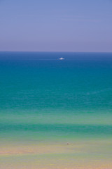 Shades of the sea and blue sky.