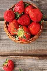Delicious juicy strawberries on a wooden table