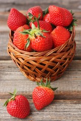 Delicious juicy strawberries on a wooden table