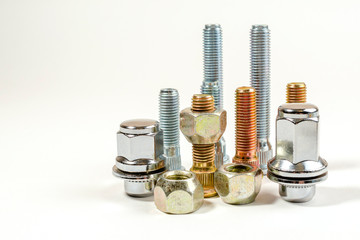 nuts and studs for a car on a table