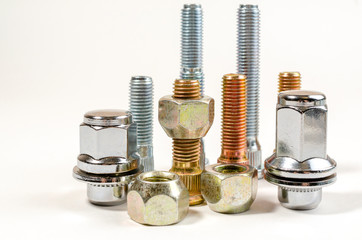nuts and studs for a car on a table