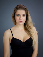 Fototapeta premium Portrait of nice pretty blonde lady isolated over grey background. Beauty and lifestyle concepts