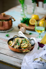 Pork picatta in copper bowl. style rustic