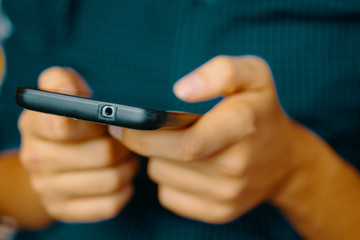 Using Smartphone. Close up of a man using mobile smart phone.