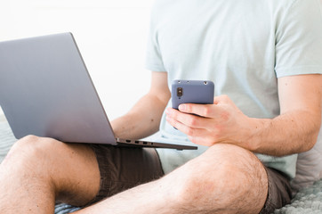 Coronavirus. Quarantine. A man solves questions on work remotely.