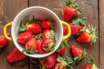 fragrant ripe strawberries on a wooden surface