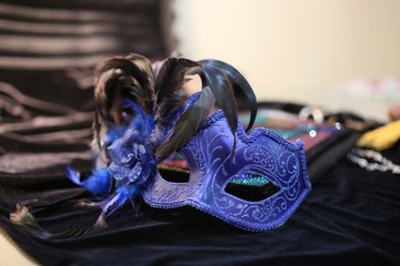 On black velvet dress blue mask from  masquerade
