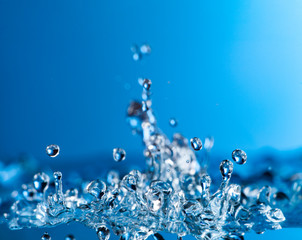 Fototapeta na wymiar abstract drop water splash on blue background