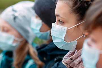 School-age children in medical masks. portrait of school children.