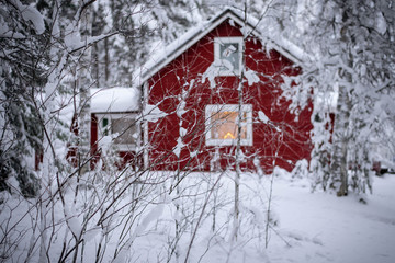 red house in winter in Finland