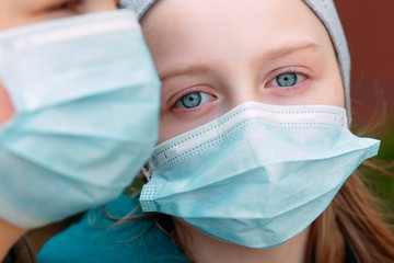 School-age children in medical masks. portrait of school children.