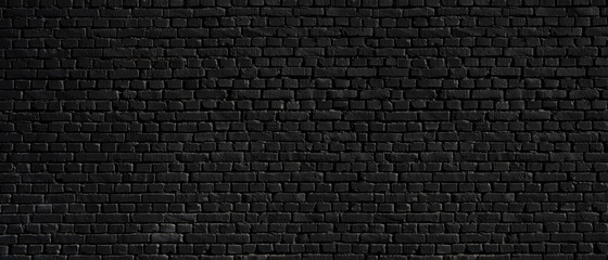 Texture of a black brick wall as a background or wallpaper