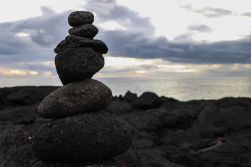 A tower of stones near to the ocean. Harmony, equilibrium, clamness, relax.