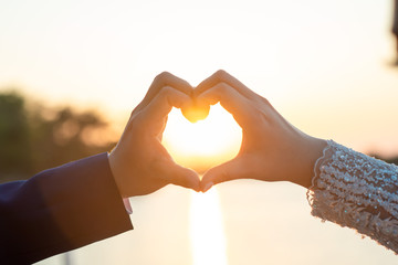 Women and men hold hands in the evening