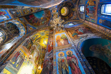 Fototapeta na wymiar Looking up at the colorful mosaic covered dome ceilings inside the Church of Our Savior on Spilled Blood in Saint Petersburg, Russia.
