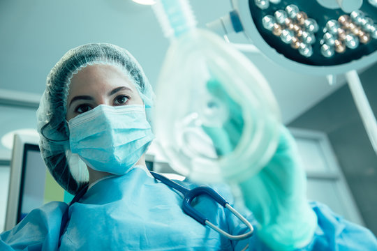 Experienced anesthesiologist doing her work stock photo