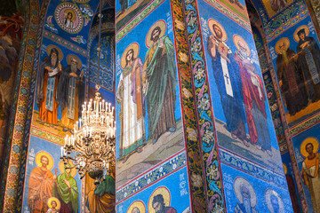 Fototapeta na wymiar Close up of a support column covered in brilliant colorful mosaics in the interior of the Church of Our Savior on Spilled Blood in Saint Petersburg, Russia.