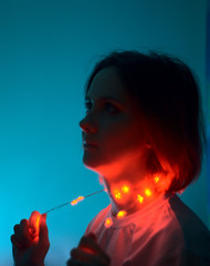 Fototapeta premium young woman with red garland on her beautiful neck