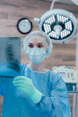 Doctor checking chest x ray before the operation stock photo