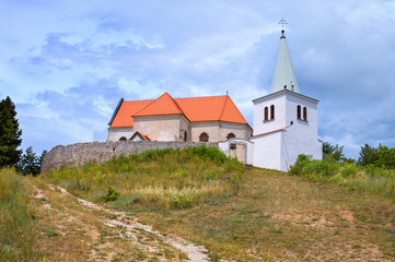 Fototapeta premium Church of Saint Michael, archangel. Situated above the Kocin - Lancar village, west of the Slovak city Piestany. Fortified Renaissance building from the 17th century. Ancient church build on the hill