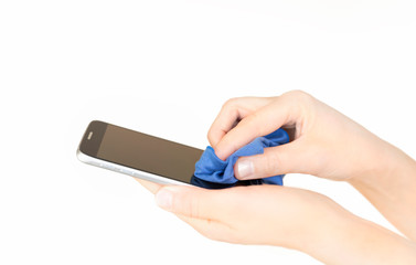 A person cleaning mobile phone to prevent the spread of germs, bacteria and coronavirus
