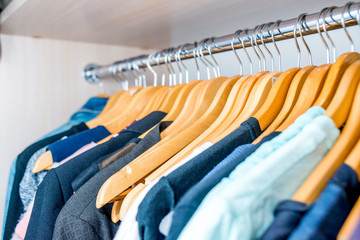 Lot of different clothes on hangers. Copy space