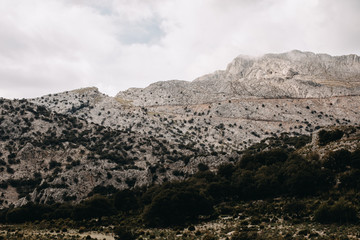 wide scenic mountain landscape with cloudy sky