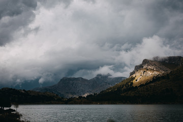 scenic mountain landscape with lake and clouds